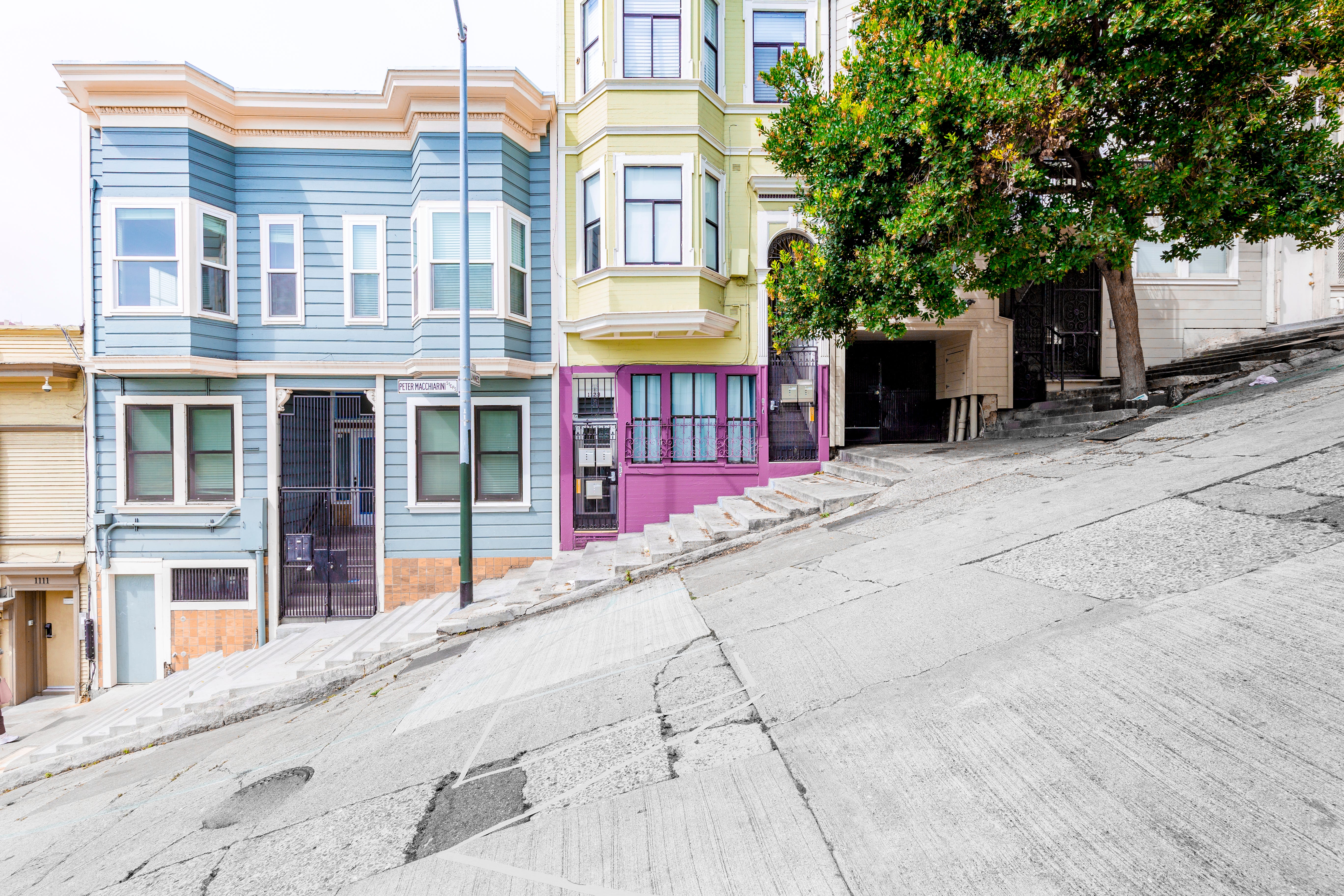 Historic colorful buildings along one of San Francisco’s steepest streets near the Telegraph Hill residential area.
