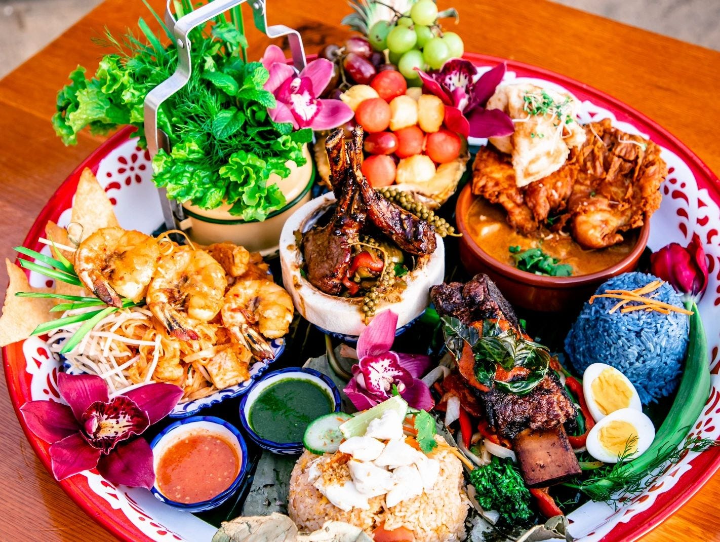 A family-style platter of small dishes.