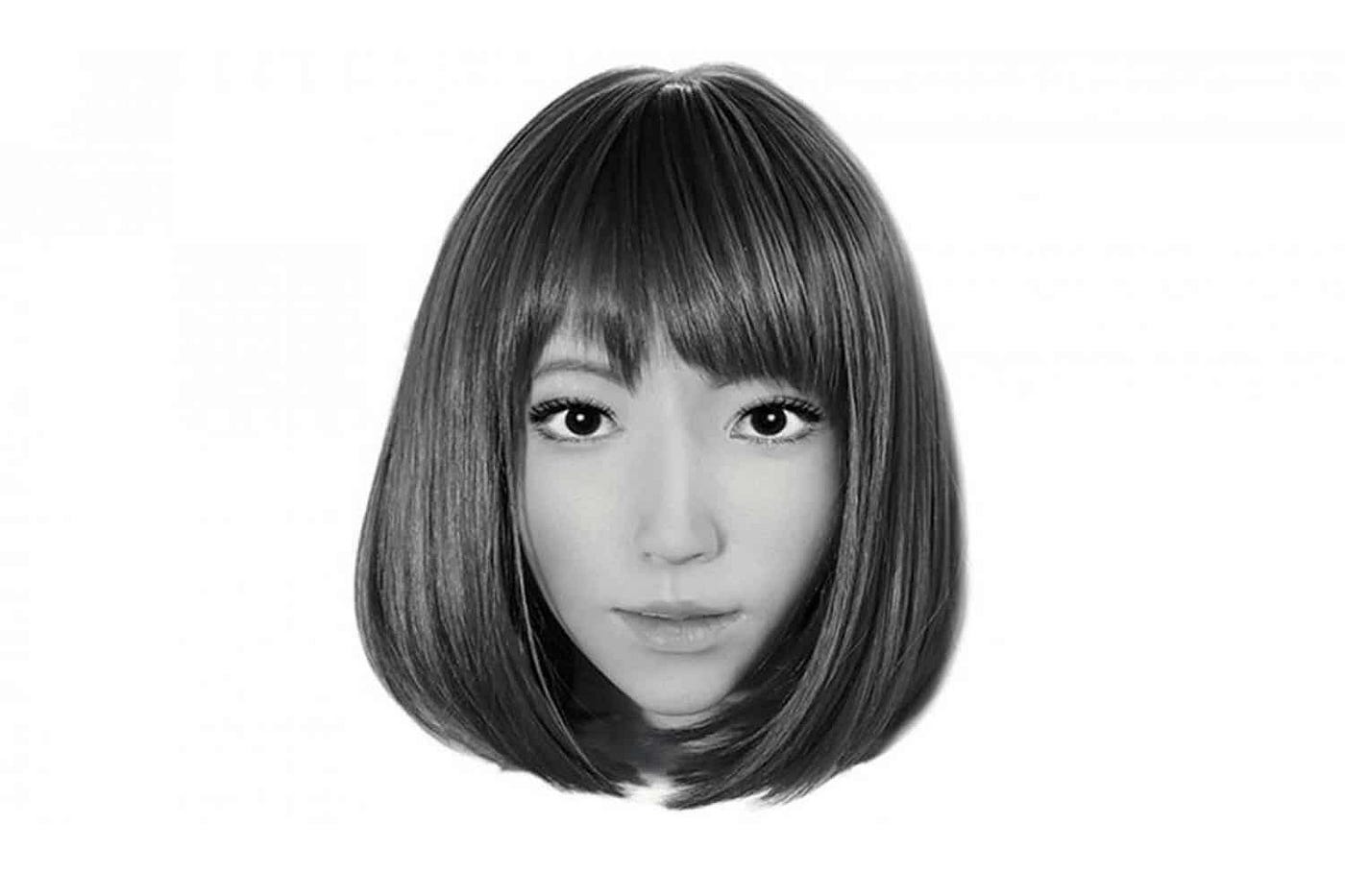 A desaturated, disembodied head of a person with a bob haircut on a white background.