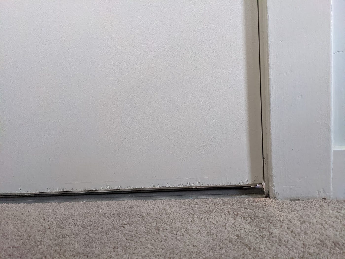 A gap at the bottom of a door.