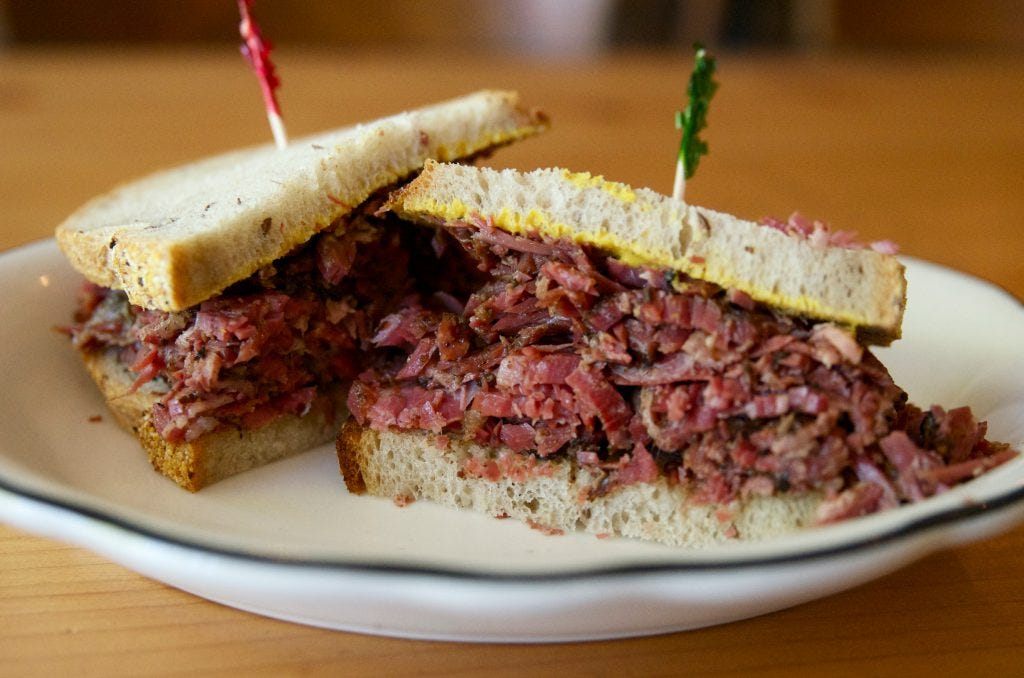 Grilled, smoked meat sandwich.