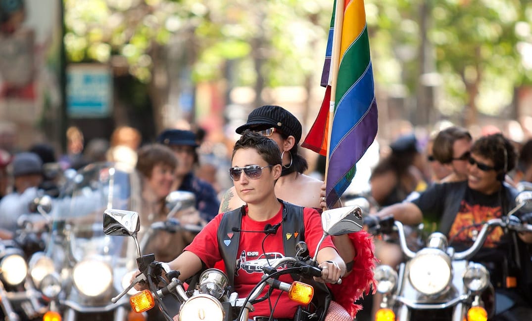 Historic Photos Give Us A Glimpse Back at 50 Years of Pride Parades